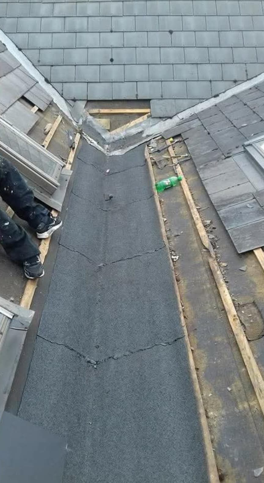 Close-up of roof tiles being repaired by expert roofers