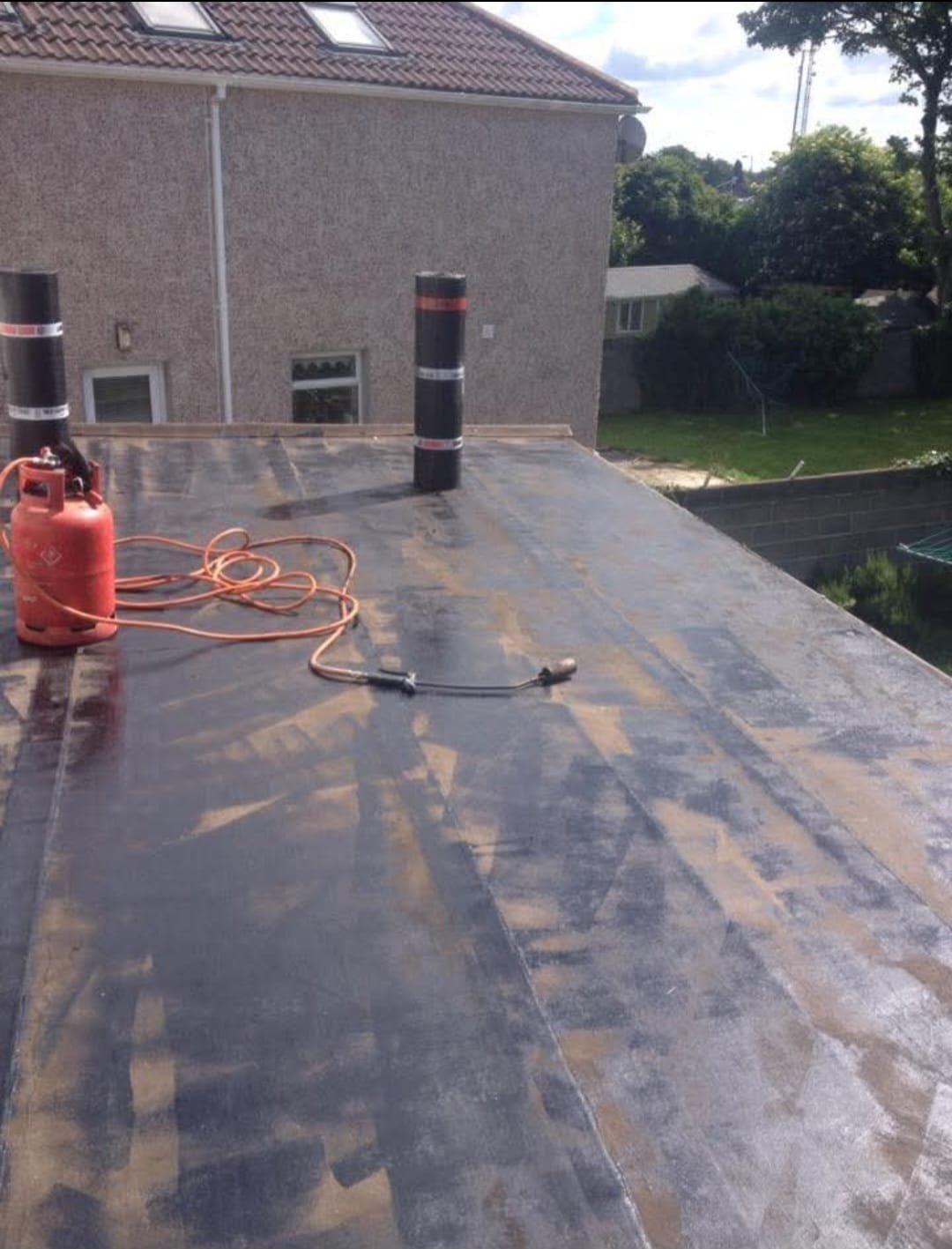 Ridge tile repairs on a traditional tile roof