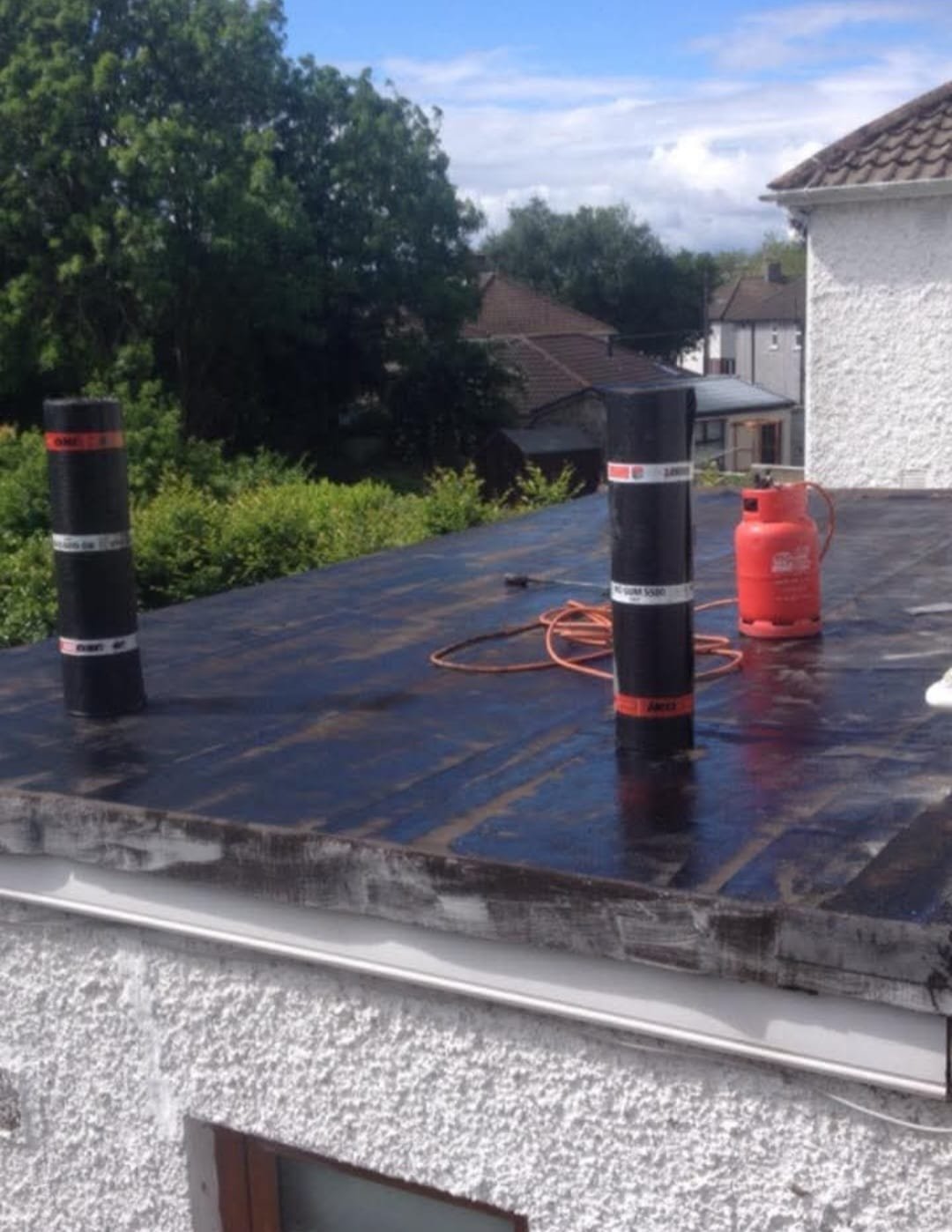Emergency roofing team responding to a leaking roof callout