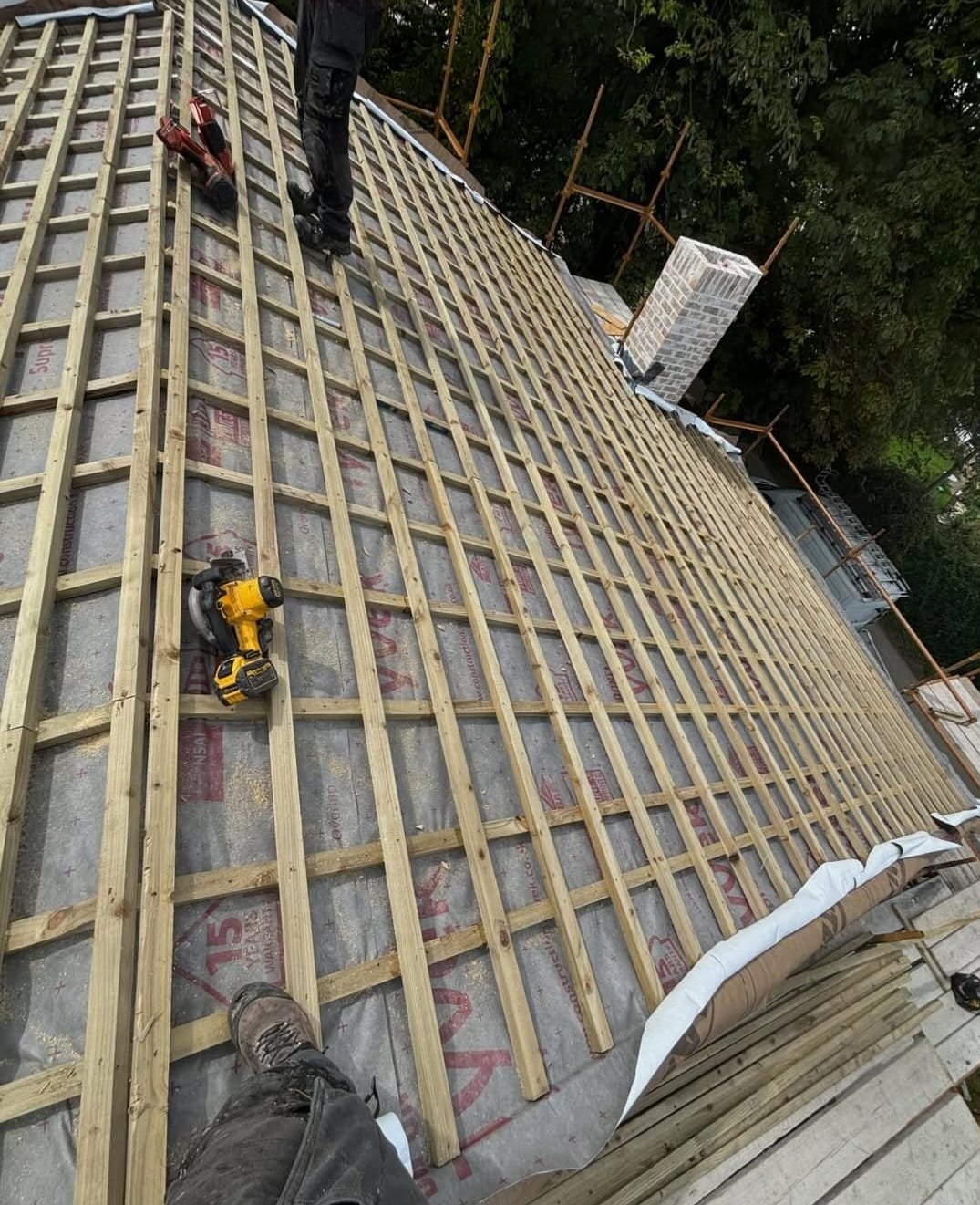 Torch-on felt roof installation on a residential extension