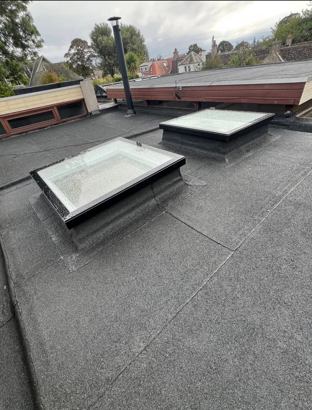 Dublin roofer fixing storm-damaged roof tiles