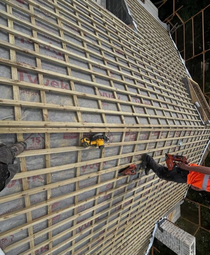 Emergency roof repair team fixing storm damage on a Dublin property